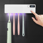 Toothbrush disinfector with UV light